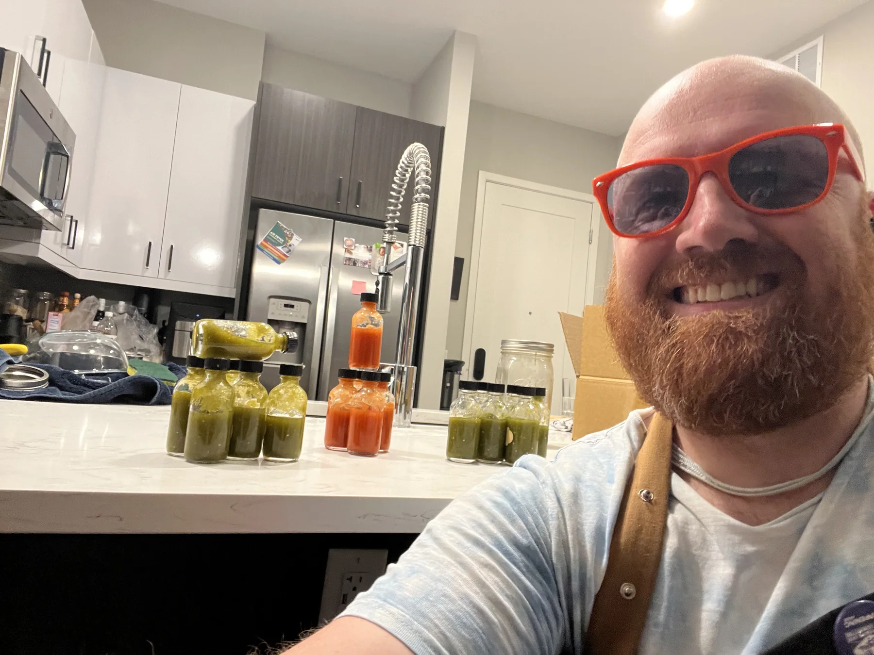 Oliver in the kitchen with homemade hot sauce