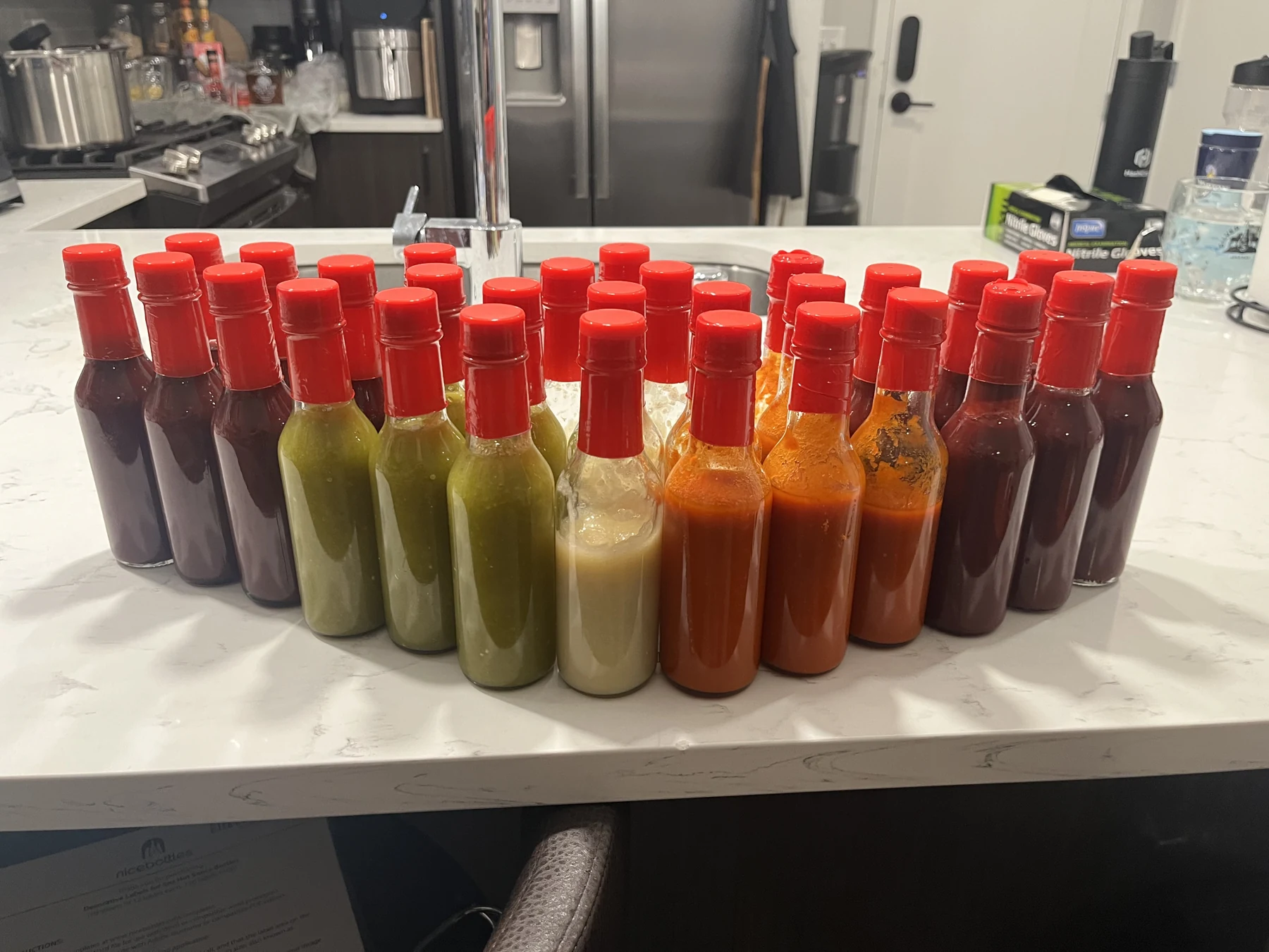 5.5 ounce woozy bottles used for finished homemade hot sauce